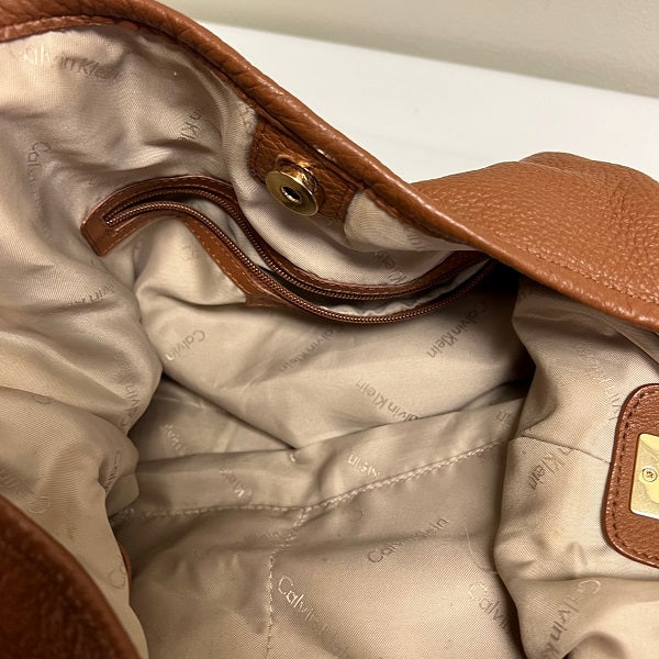 Calvin klein brown leather purse on sale